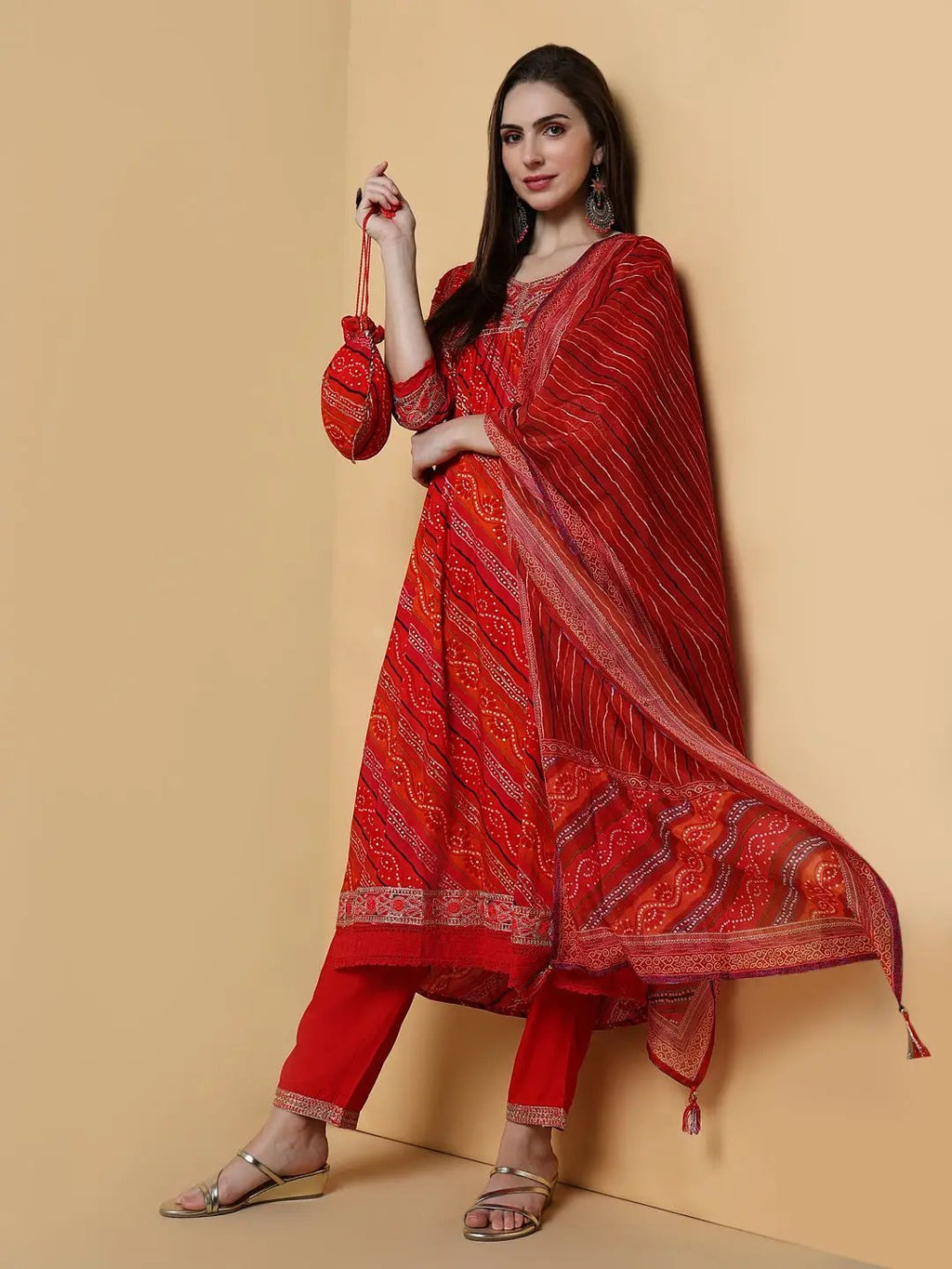 Women's Graphic Orange A-Line Kurta Set with Dupatta & Potli Bag