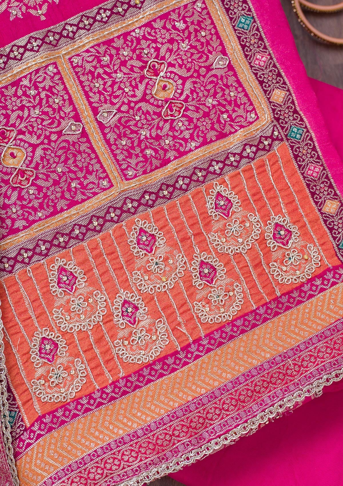 Rani Pink Cutdana Semi Crepe Unstitched Salwar Suit